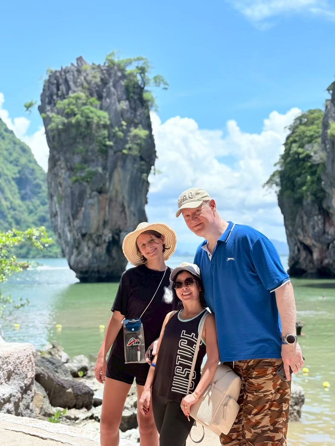 A family posing in front of James Bond Island