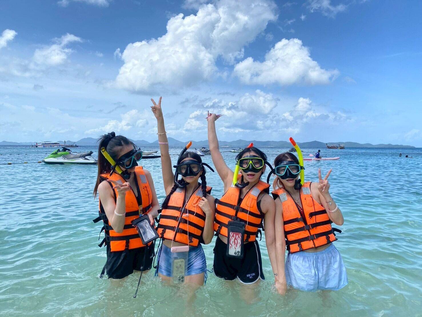 Guests posing in the shallows before the Racha Island snorkeling trip
